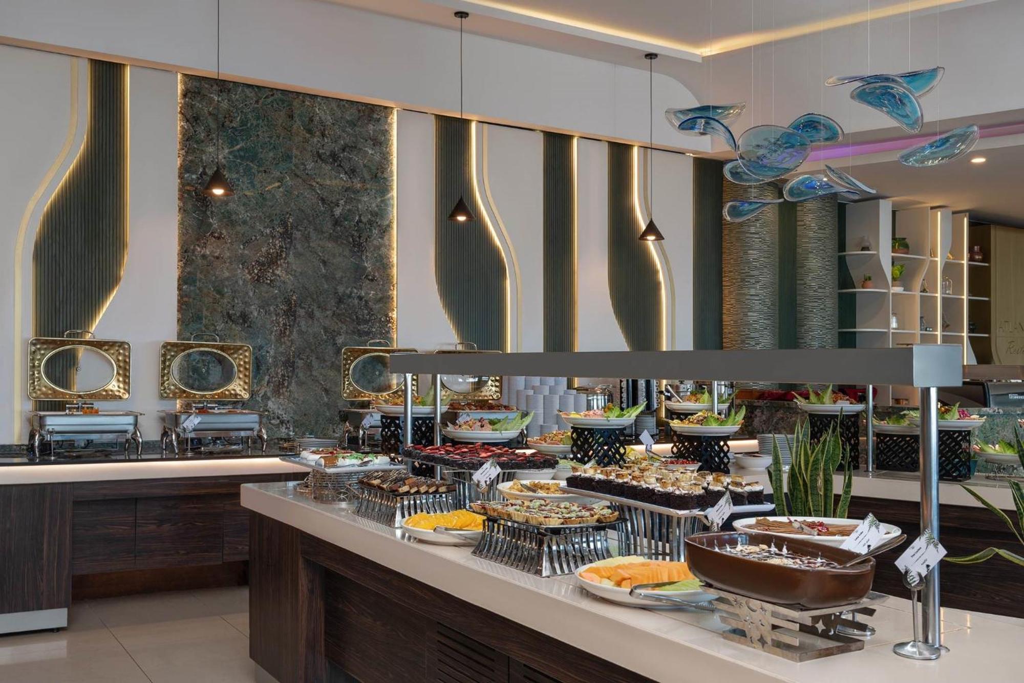 Titanic Hotel & Spa Sulaymaniyah Екстер'єр фото A buffet at a hotel